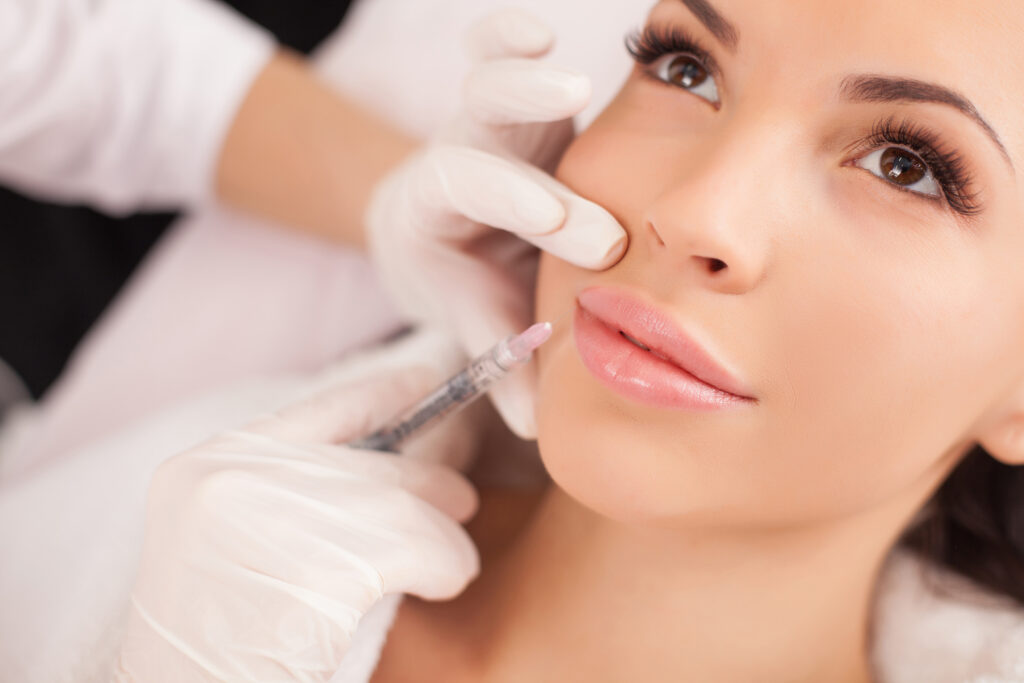 Women getting Botox injection on lips | RO Aesthetics in Holladay, UT